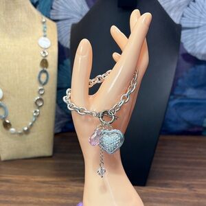 Elegant Silver Tone Bracelet with Heart Charm and Pink Details